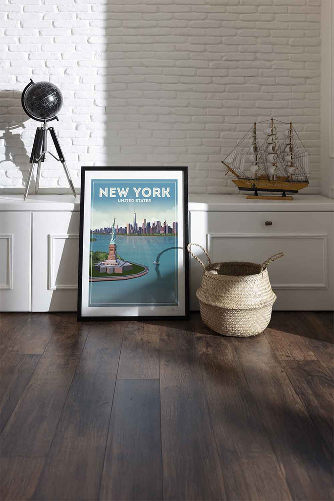 Framed New York City poster on a wall with a white brick background